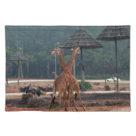 Two giraffes comforting each other in a zoo place mat
