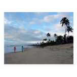 Two girls walking on the beach postcard