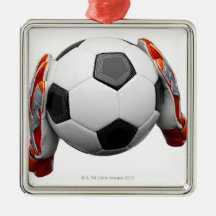 Two goal keepers gloves holding a football christmas tree ornament