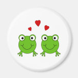 Two green frogs with red hearts. refrigerator magnets