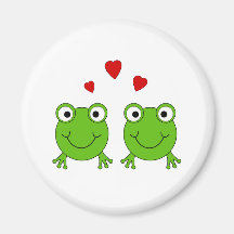 Two green frogs with red hearts. refrigerator magnets