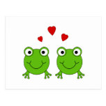Two green frogs with red hearts. post card