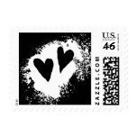 Two hearts black and white grungy stain postage stamp