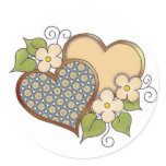 Two hearts with blossoms yellow round sticker
