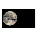 two helicopters silhouetted by a full moon business card
