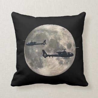 two helicopters silhouetted by a full moon pillows
