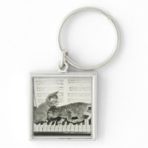 Two kitten playing on piano keyboard, (B&W) Keychains