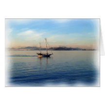 Two-Masted sailboat motoring on bay Card