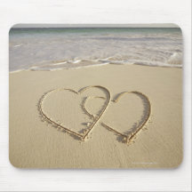 Two overlying hearts drawn on the beach mousepads