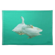 two playful happy geese in color background place mat