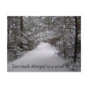 Two roads diverged in a wood winter postcard