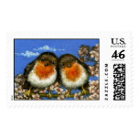 Two robins singing love songs in cherry blossom stamp