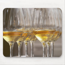 two rows of wine tasting glasses with lucious mouse pad