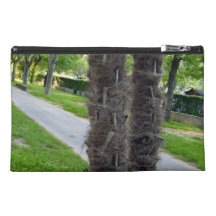 Two trees growing closely together travel accessory bags