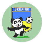 This adorable little panda is too cute! He's featured in front of a large flag from Ukraine and ready to play football and score some goals. This cute design is perfect for football players and soccer fans.