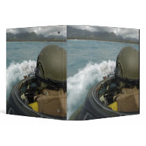 US Marine driving an amphibious assault vehicle Binder