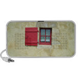 Vibrant Red Window Frame In A Yellow Wall Travel Speaker