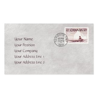 A business card like a postage stamp - A Canadian 10 cent stamp showing an eskimo in a kayak on a calm sea with an iceberg in the background, and a passenger jet in the skies above. It's stamped with a Toronto, Ontario postmark, dated 1955.