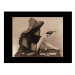 Vintage cowgirl with gun postcard