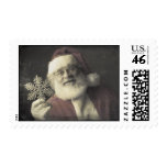 Vintage Santa Claus holding Snowflake Stamp