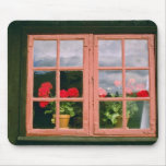 Violet Geraniums In The Window Of A Traditional Ho Mousepads