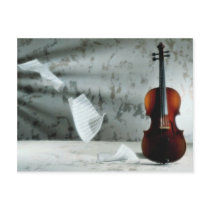 Violin with music sheets floating postcard