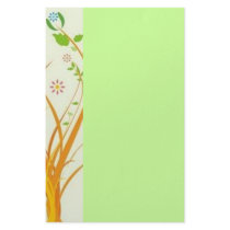Volutes with flowers on green reason - stationery paper
