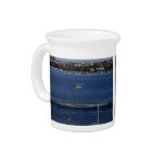 War flight flying low over the ocean drink pitcher