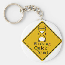 Warning quick sand key chain