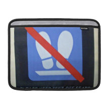 Warning sign inside train MacBook sleeves
