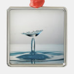 Water drops colliding to shape an umbrella ornaments