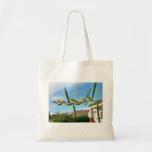 Wattle pods against blue sky tote bags