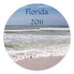 Waves Crash on the Sandy Beach Round Sticker