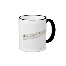 Wellness Spelled On A Word Board Game. Mugs