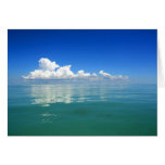 White cloud over a placid ocean cards