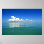 White cloud over a placid ocean poster