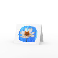 White daisy flower against light blue background card