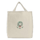 basic_tote_bag - Traditional embroidered Christmas design features lovely white doves a symbol of peace and love on evergreen wreath with red ribbon accent. Lovely elegant touch for holiday wear and tote bags.