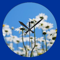 White flowers on blue sky wall clocks
