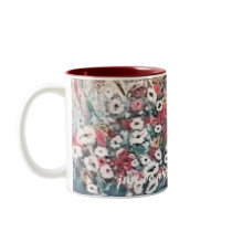 White mug with red has floral painting in blue red