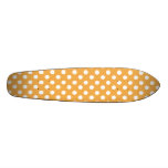 White polkadots on orange skateboard deck