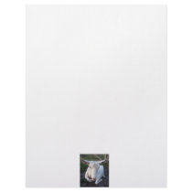 White Saanen dairy goat doe lying down relaxing Letterhead