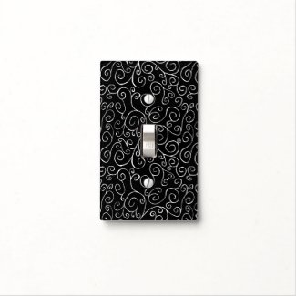 White Scrolling Curves on Black Light Switch Plate