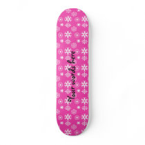 White snowflakes on pink skate board deck
