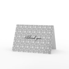 White snowflakes on silver card