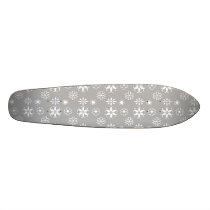 White snowflakes on silver skateboard