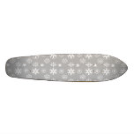 White snowflakes on silver skateboard