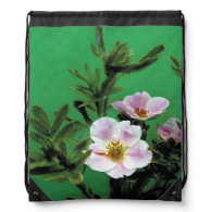 wild pink rose flowers in green. backpacks