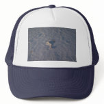 Windblown patterns in snow trucker hat
