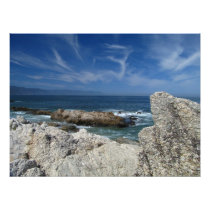 Wispy Clouds Over The Rocks
